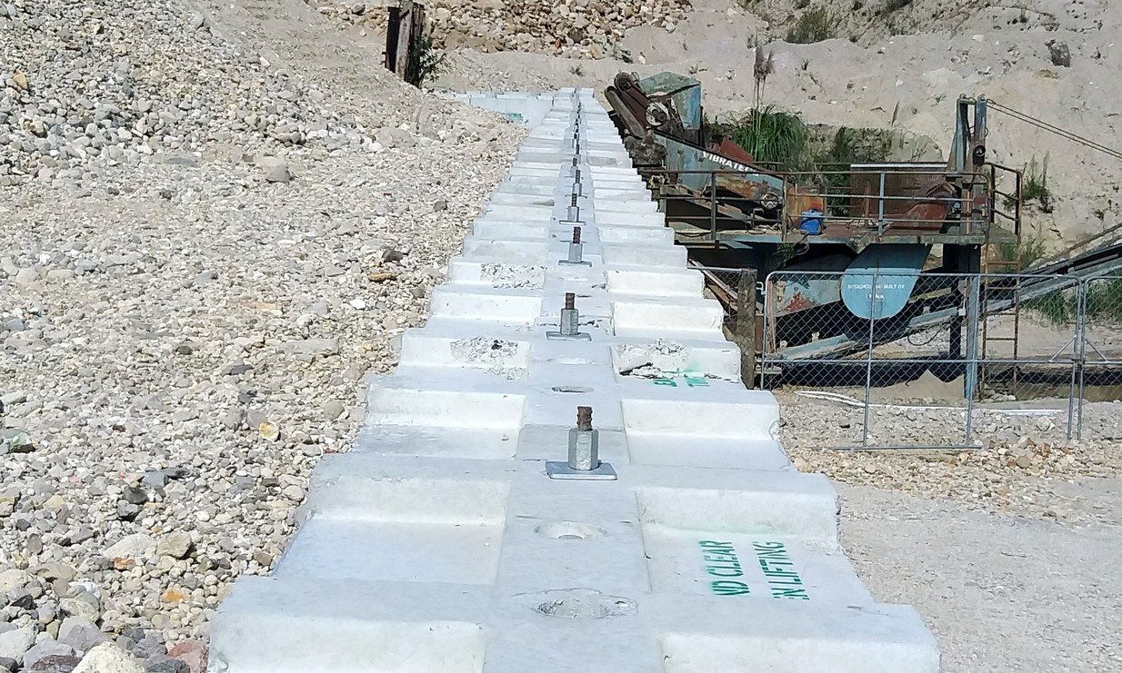 Interbloc concrete blocks forming a level foundation under a portable building
