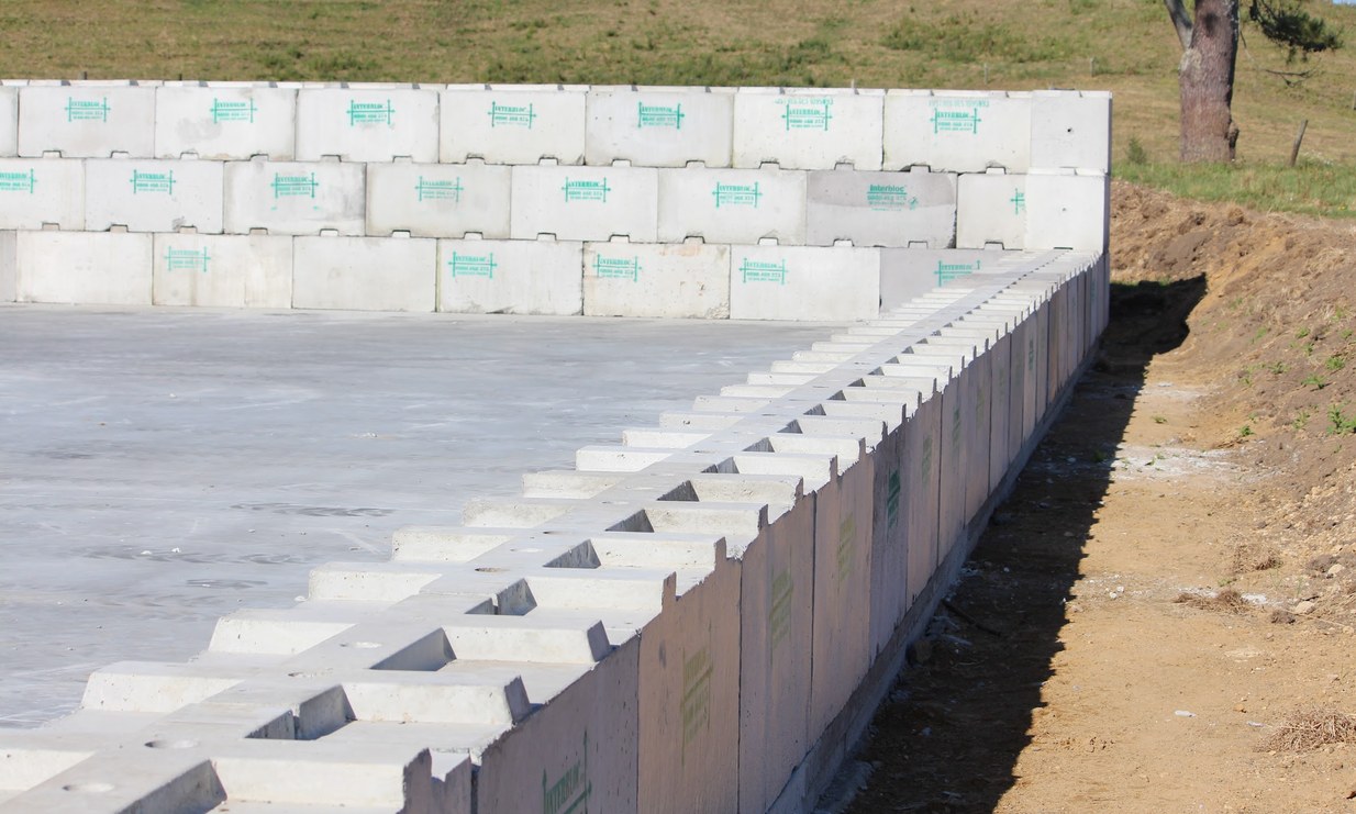 Interbloc concrete blocks forming a level foundation under a portable building