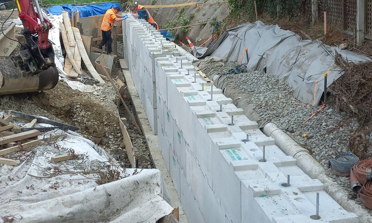 Interbloc concrete barriers managing traffic on a live road