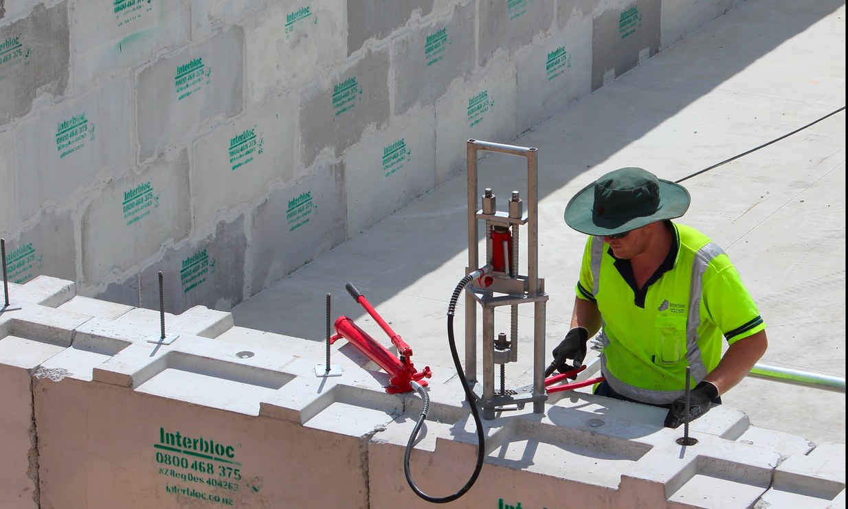 Reinforced Interbloc cantilever retaining wall under construction