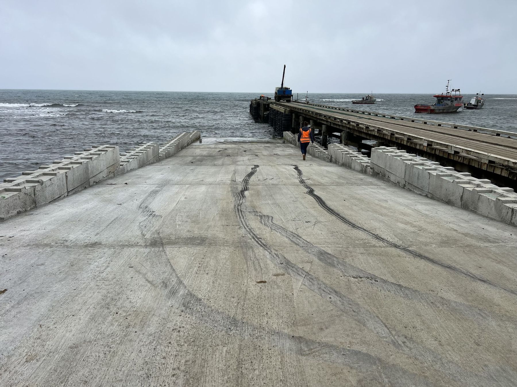 The completed Owenga ramp in use, with fishing boats moored alongside