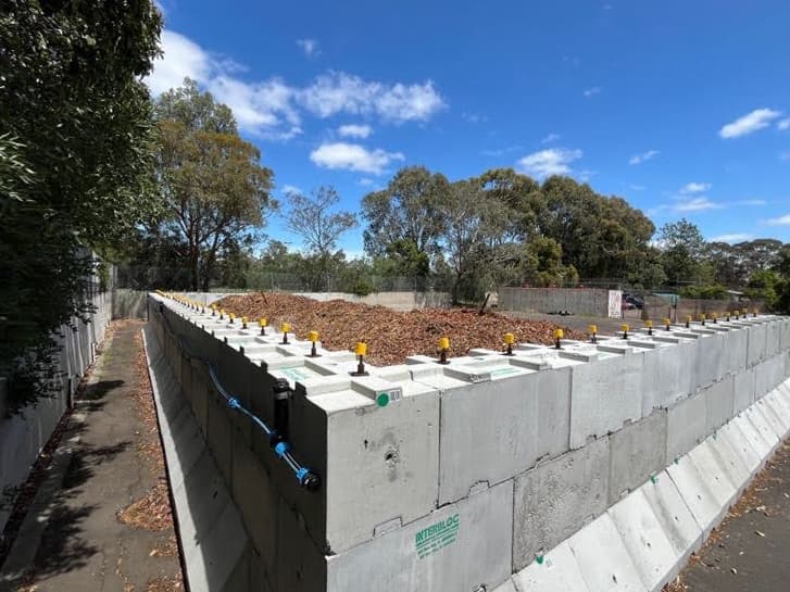 Interbloc mulch storage bunker built on a former asphalt tennis court for Banyule City Council
