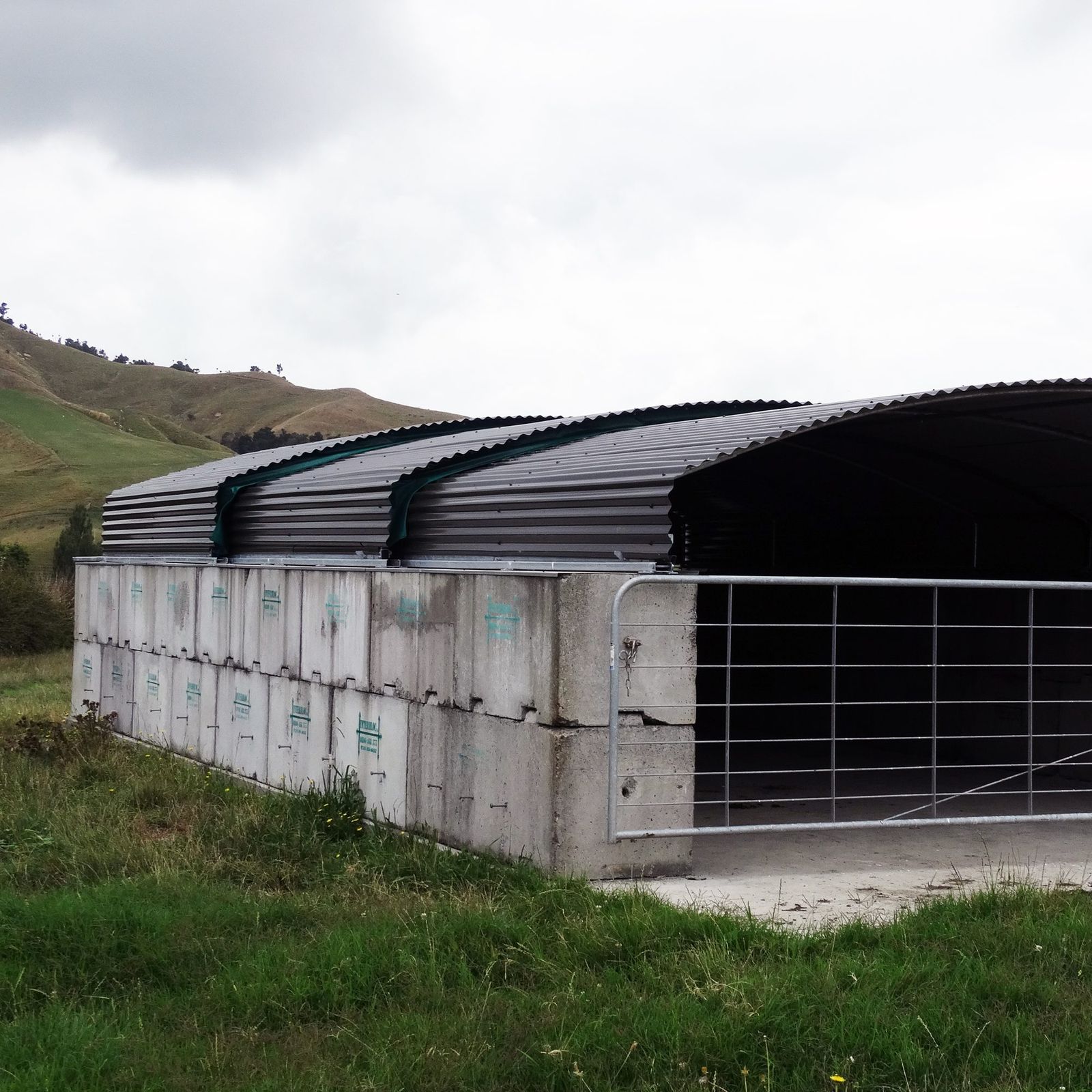 Interbloc bunker bay with a curved roof at a fertiliser storage site